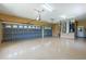 Spacious three-car garage with epoxy floors, ample lighting, and doors with windows for natural light at 5815 Ne 70Th St, Silver Springs, FL 34488