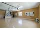 Spacious three-car garage with epoxy floors, ample lighting, and plenty of room for storage and projects at 5815 Ne 70Th St, Silver Springs, FL 34488