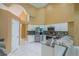 Bright kitchen featuring white cabinetry, stainless steel appliances, and granite countertops at 5815 Ne 70Th St, Silver Springs, FL 34488