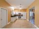 Eat-in kitchen featuring stainless steel appliances, white cabinets, granite countertops, and tile backsplash at 5815 Ne 70Th St, Silver Springs, FL 34488