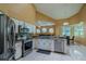 Modern kitchen with stainless steel appliances, granite countertops, and tile backsplash at 5815 Ne 70Th St, Silver Springs, FL 34488