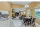 Open-concept living room with a fireplace, built-in shelving, and a dining area at 5815 Ne 70Th St, Silver Springs, FL 34488