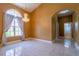 Open-concept living space with tile flooring, chandelier, and large windows providing natural light at 5815 Ne 70Th St, Silver Springs, FL 34488