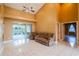 An expansive living room with comfortable seating and access to a screened lanai and pool area at 5815 Ne 70Th St, Silver Springs, FL 34488
