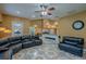 Spacious living area with ornate tile flooring, comfortable furniture, and open access to the kitchen at 5815 Ne 70Th St, Silver Springs, FL 34488