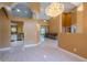 Open living space with tile flooring, flowing into the kitchen and sun-drenched living area at 5815 Ne 70Th St, Silver Springs, FL 34488