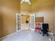 Bright office space with French doors leading to living space with tile flooring and natural light at 5815 Ne 70Th St, Silver Springs, FL 34488