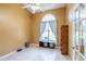 Bright office space with a vaulted ceiling, large arched window with white curtains, and tile flooring at 5815 Ne 70Th St, Silver Springs, FL 34488