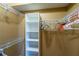 Spacious walk-in closet with built-in shelving and ample hanging space at 5815 Ne 70Th St, Silver Springs, FL 34488