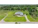 A sprawling estate with well-maintained landscaping, circular driveway, and lush green lawn at 6573 S Magnolia Ave, Ocala, FL 34471