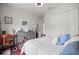 Cozy bedroom with a dresser, closet, and a comfortable bed with blue pillows at 6573 S Magnolia Ave, Ocala, FL 34471