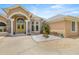 Beautiful home with stone details, a grand entrance, and manicured landscaping at 6573 S Magnolia Ave, Ocala, FL 34471