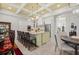 Bright kitchen featuring granite countertops, a large island with seating, and open access to the dining area at 6573 S Magnolia Ave, Ocala, FL 34471