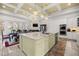 Spacious eat-in kitchen featuring a large island, double oven, and breakfast nook with backyard access at 6573 S Magnolia Ave, Ocala, FL 34471