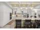 Gourmet kitchen with a large island, stone countertops, pendant lighting, and stainless steel appliances at 6573 S Magnolia Ave, Ocala, FL 34471