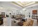 Expansive living room with high ceilings, neutral tones, and seamless access to the kitchen for modern living at 6573 S Magnolia Ave, Ocala, FL 34471