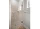 Beautiful walk-in shower with neutral tile and a clear glass door at 6573 S Magnolia Ave, Ocala, FL 34471