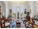 Sitting area with wooden furniture, art, natural light, hardwood floors, and plenty of space for entertaining at 6573 S Magnolia Ave, Ocala, FL 34471