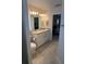 Bathroom with white cabinets, double sink vanity, and tile flooring at 6836 Sw 179Th Court Rd, Dunnellon, FL 34432