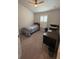 Bedroom with neutral carpet, a desk area, and a window with shutters at 6836 Sw 179Th Court Rd, Dunnellon, FL 34432