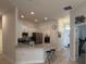 Modern kitchen with stainless steel appliances and an eat-in breakfast bar offering great views at 6836 Sw 179Th Court Rd, Dunnellon, FL 34432