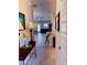 Bright, open living space featuring wood-look floors and neutral décor, open to other rooms in the home at 6836 Sw 179Th Court Rd, Dunnellon, FL 34432