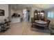 Open living area with bright, neutral colors, kitchen access, and a dining area at 6836 Sw 179Th Court Rd, Dunnellon, FL 34432