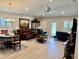 Bright and inviting living room featuring recessed lighting, a ceiling fan, and multiple seating areas at 6836 Sw 179Th Court Rd, Dunnellon, FL 34432