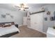 Spacious bedroom featuring a fan, neutral walls, carpet and wall decor at 7479 Sw 130Th Ln, Ocala, FL 34473