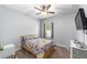 bedroom with bright Pokemon bedding, ceiling fan, natural light and carpet at 7479 Sw 130Th Ln, Ocala, FL 34473