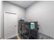 Laundry room with modern washer and dryer and white door at 7479 Sw 130Th Ln, Ocala, FL 34473