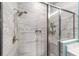 Walk-in shower featuring sleek fixtures, contemporary tile work, and a convenient built-in niche at 7479 Sw 130Th Ln, Ocala, FL 34473