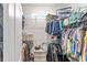 This walk-in closet boasts ample storage space with custom shelving and organization systems at 7479 Sw 130Th Ln, Ocala, FL 34473