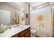 Bright bathroom featuring a decorative shower curtain, updated fixtures, and a clean, functional design at 7917 Sw 85Th Loop, Ocala, FL 34476