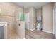 Tiled walk-in shower and bathroom vanity with tiled backsplash, modern fixtures and private toilet area at 7917 Sw 85Th Loop, Ocala, FL 34476