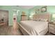 Light green bedroom with lots of room and a door leading to other rooms in the home at 7917 Sw 85Th Loop, Ocala, FL 34476