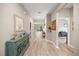 Neutral-toned foyer with hardwood flooring and an open view into the living spaces at 7917 Sw 85Th Loop, Ocala, FL 34476