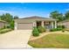 Charming single-story home with a well-manicured front yard and a two-car garage at 7917 Sw 85Th Loop, Ocala, FL 34476