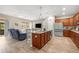 Well-lit kitchen with an island, modern appliances, and an adjacent dining area at 7917 Sw 85Th Loop, Ocala, FL 34476