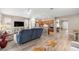 Spacious living room with hardwood floors and a combined kitchen and dining area at 7917 Sw 85Th Loop, Ocala, FL 34476