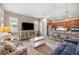Open-concept living room featuring modern decor and a seamless flow to the kitchen at 7917 Sw 85Th Loop, Ocala, FL 34476