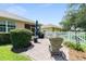 Serene backyard patio with seating and landscaping, creating a peaceful outdoor retreat at 8303 Sw 82Nd Cir, Ocala, FL 34481