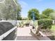 Relaxing brick patio with outdoor furniture, perfect for entertaining or enjoying quiet moments in the landscaped backyard at 8303 Sw 82Nd Cir, Ocala, FL 34481