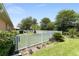 Well-landscaped backyard with a white picket fence, offering privacy and a picturesque setting at 8303 Sw 82Nd Cir, Ocala, FL 34481