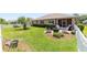 Well-maintained backyard with lush lawn, landscaping, and a cozy patio area, great for outdoor activities at 8303 Sw 82Nd Cir, Ocala, FL 34481