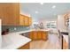 Bright kitchen has light wood cabinets, subway tile backsplash, stainless appliances, and quartz countertops at 8303 Sw 82Nd Cir, Ocala, FL 34481