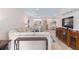 Spacious living area with wood floors and neutral decor, seamlessly connects to dining area at 8303 Sw 82Nd Cir, Ocala, FL 34481