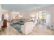Inviting living room features an open layout with wood floors, a comfortable seating arrangement, and natural light at 8303 Sw 82Nd Cir, Ocala, FL 34481