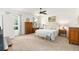 Spacious bedroom boasts a large bed, neutral tones, plush carpeting, and ample natural light at 8303 Sw 82Nd Cir, Ocala, FL 34481