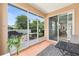 Inviting screened patio, perfect for relaxation and outdoor dining with access to a beautifully landscaped backyard at 8303 Sw 82Nd Cir, Ocala, FL 34481